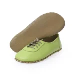 women barefoot green shoes