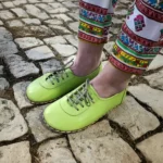 women barefoot green shoes