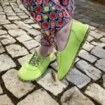 women barefoot green shoes